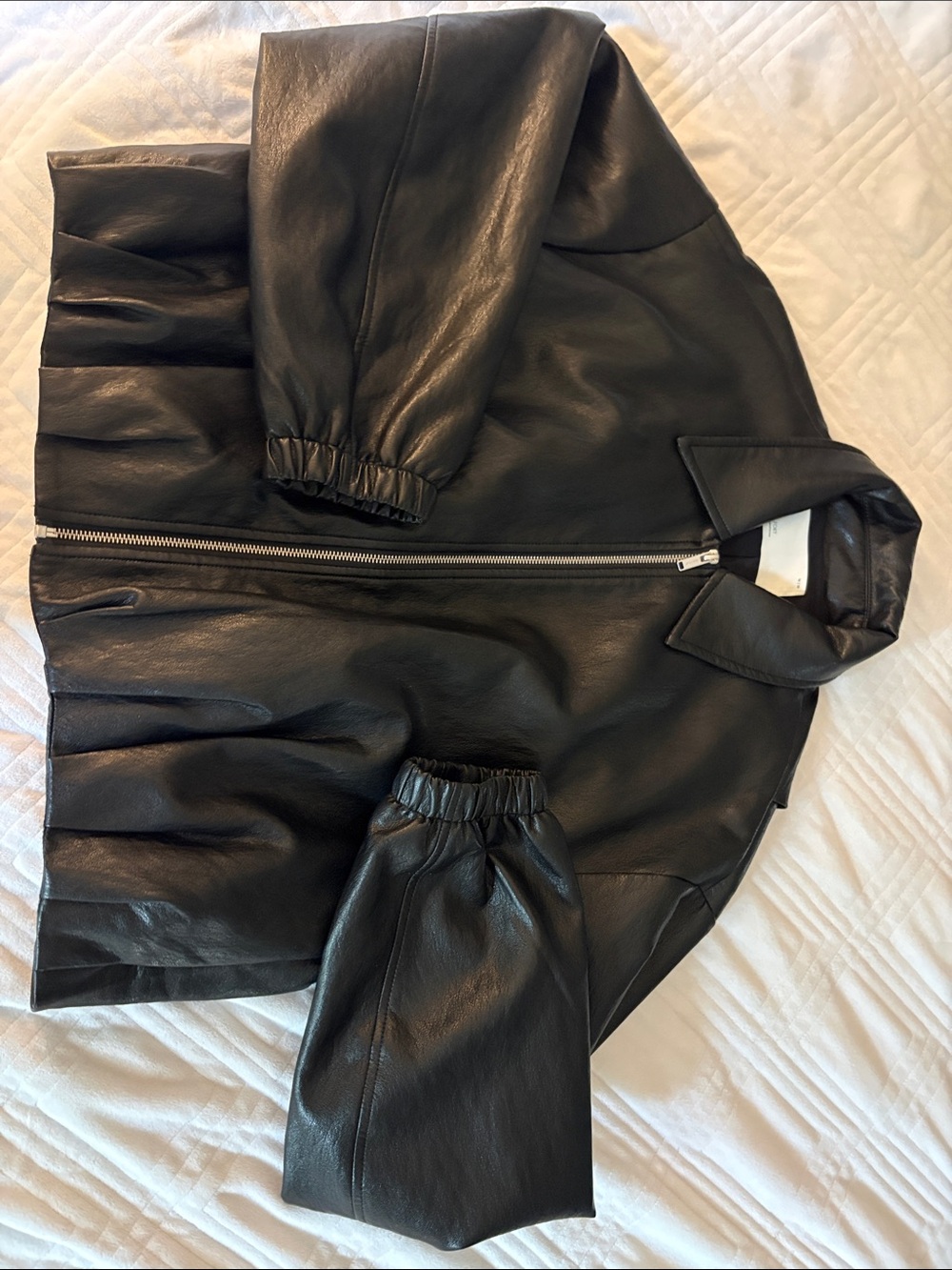 Black vegan leather bubble hem jacket